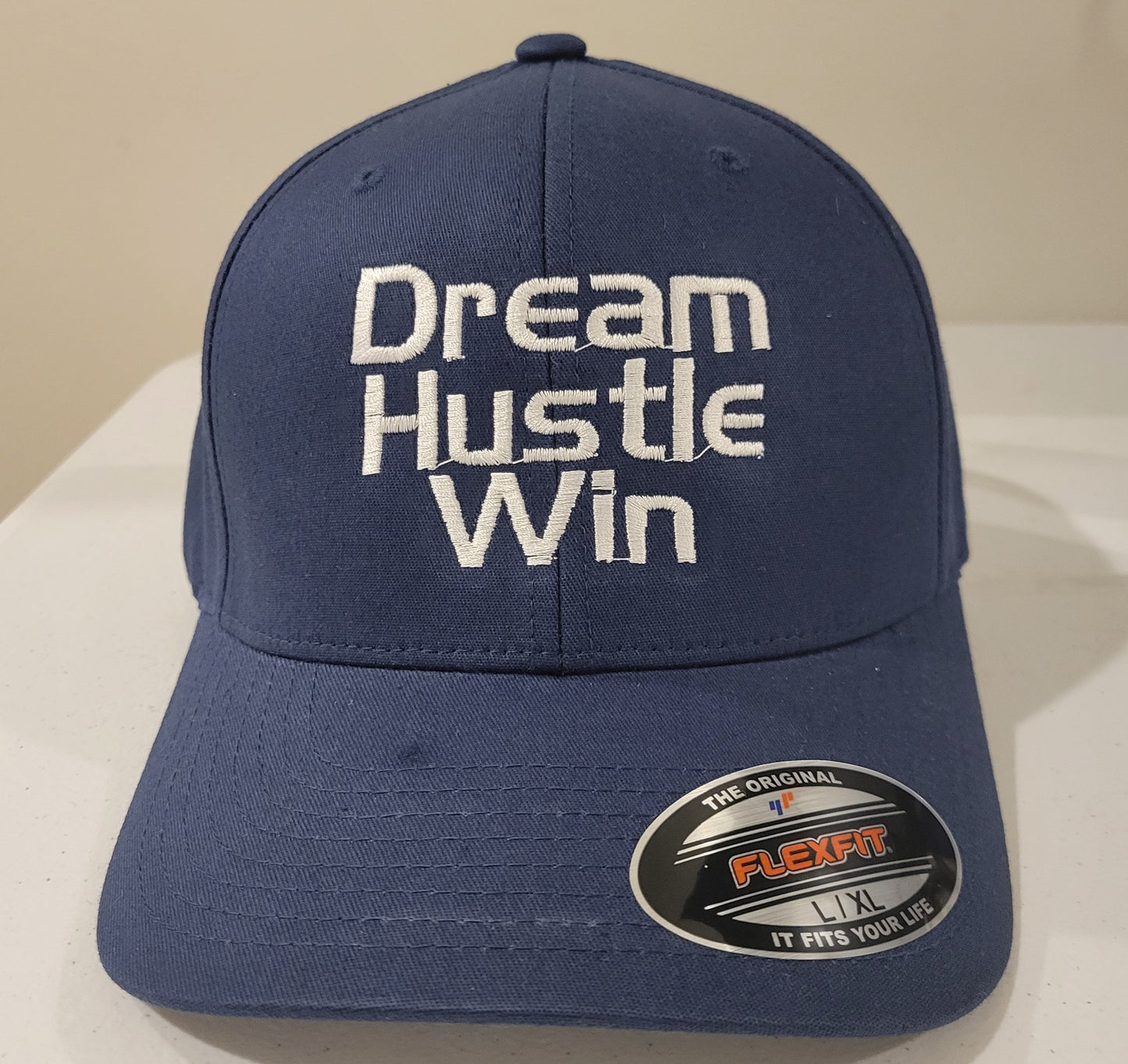 Dream, hustle, win fitted cap